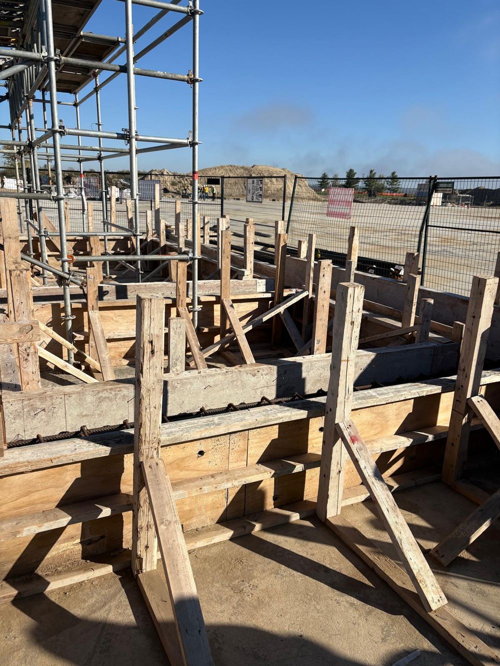 Rebar and timber formwork in progress on a concrete structure